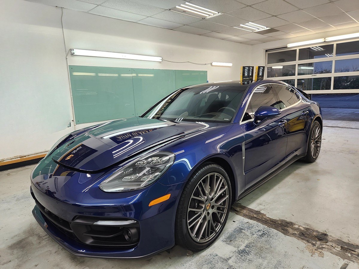 Glossy vehicle finish in the shop bay