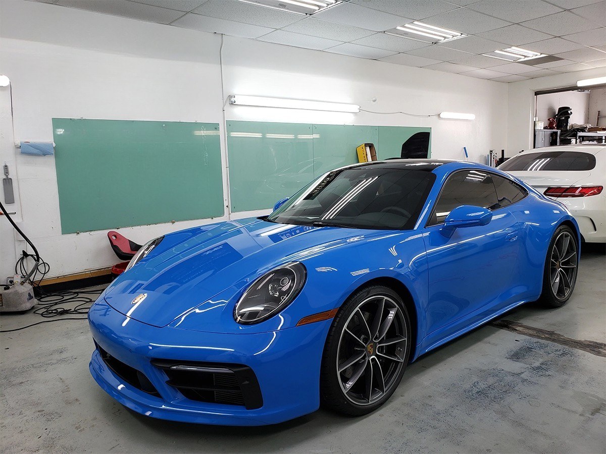 Window tint job in progress on a Porsche 911